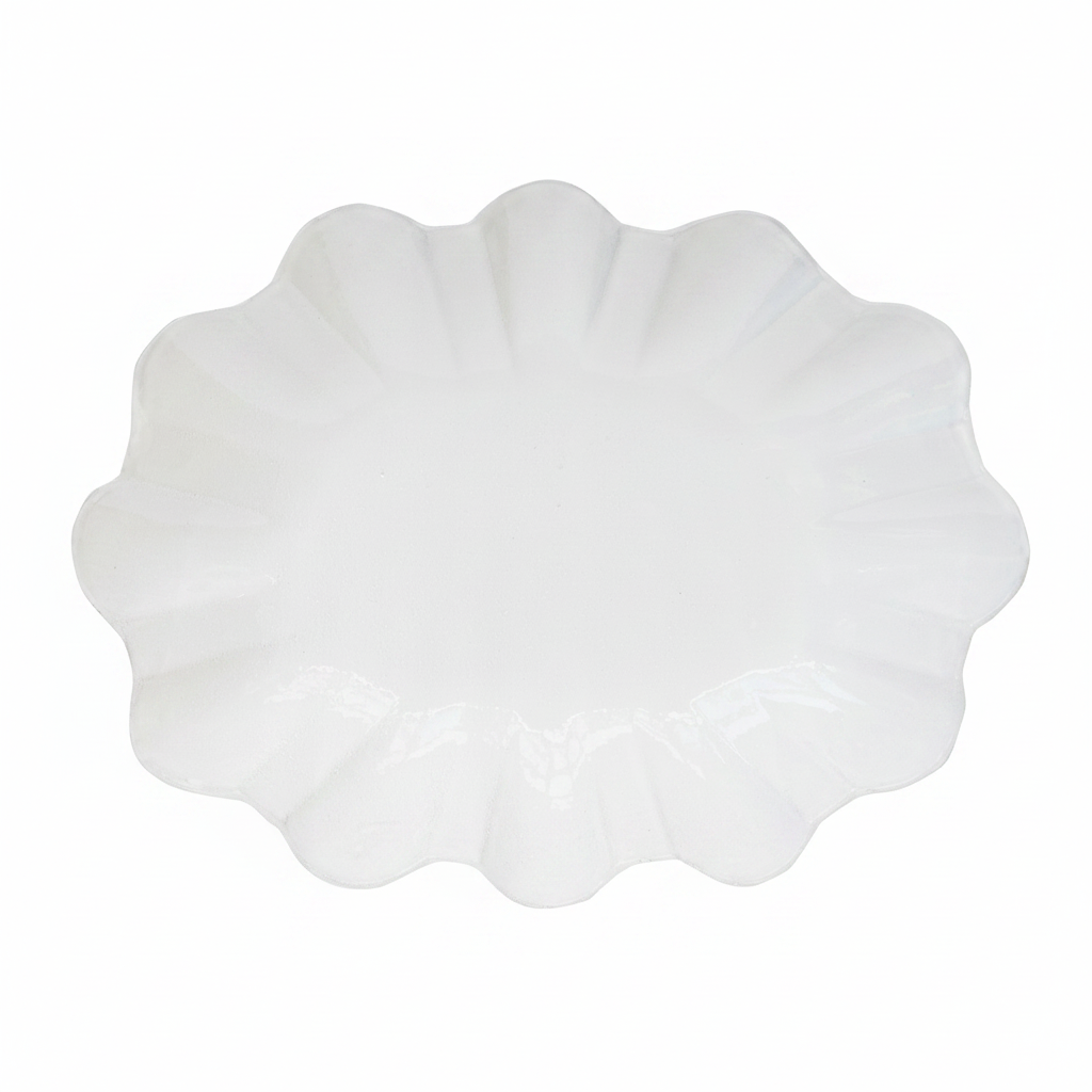 White scalloped-edge plate on a white background