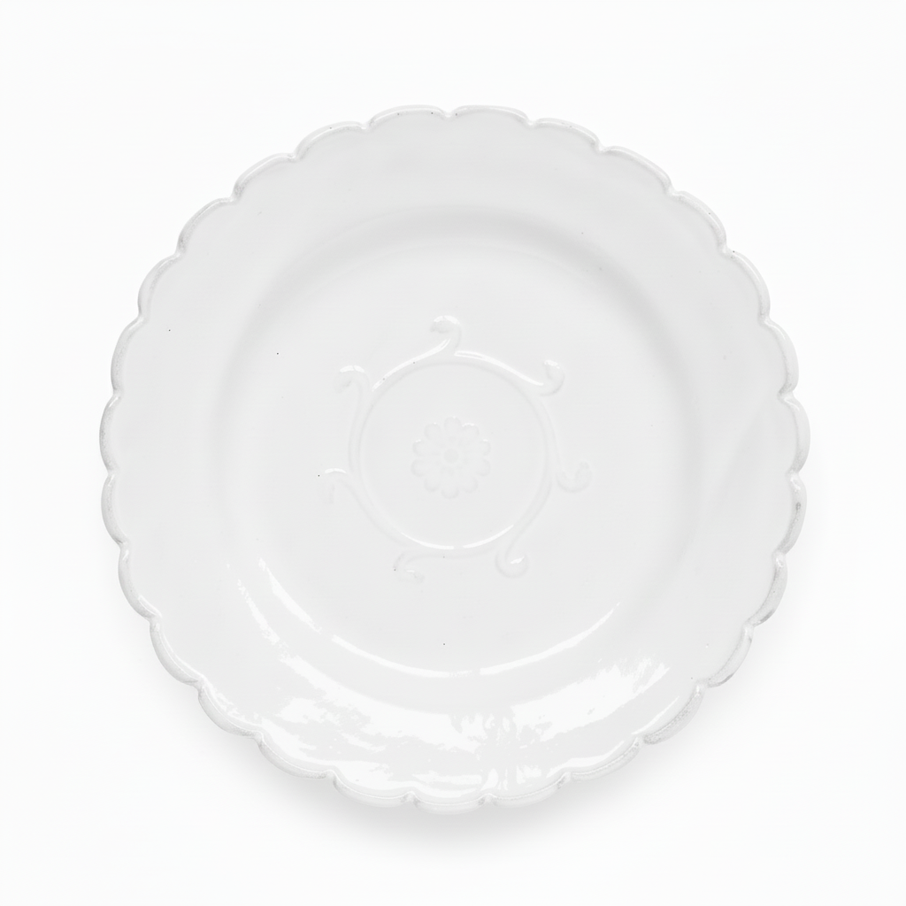 Clear plastic plate with scalloped edge on a white background