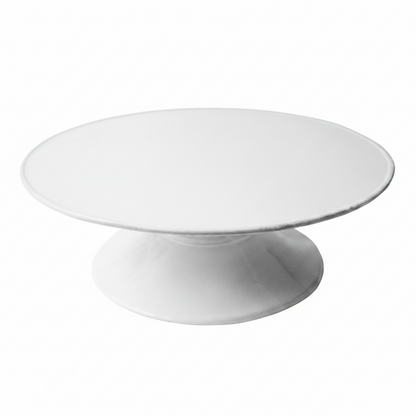 White ceramic cake stand on a white background