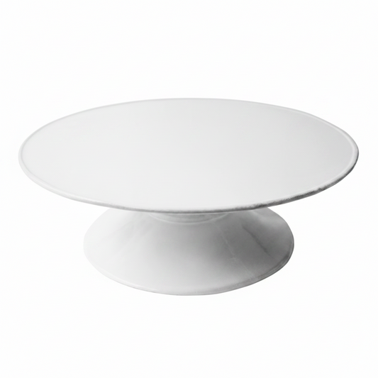 White ceramic cake stand on a white background