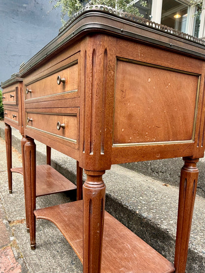 Wooden sideboard with multiple drawers and a shelf on a concrete surface.