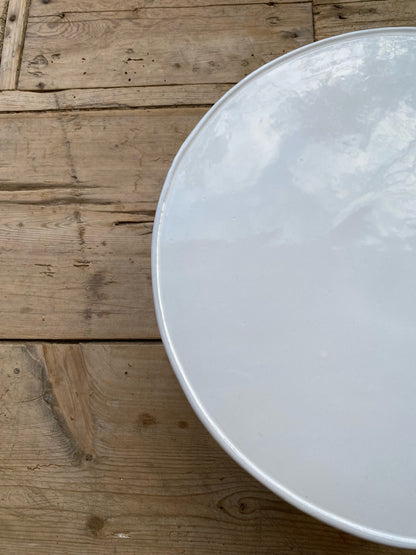 White plate on a wooden surface