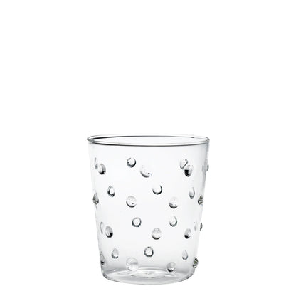 Clear glass tumbler with bubble design on a white background